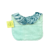 Load image into Gallery viewer, Back of the Kaiʻolu Teal baby bib showing soft mint terry and hook-and-loop closure